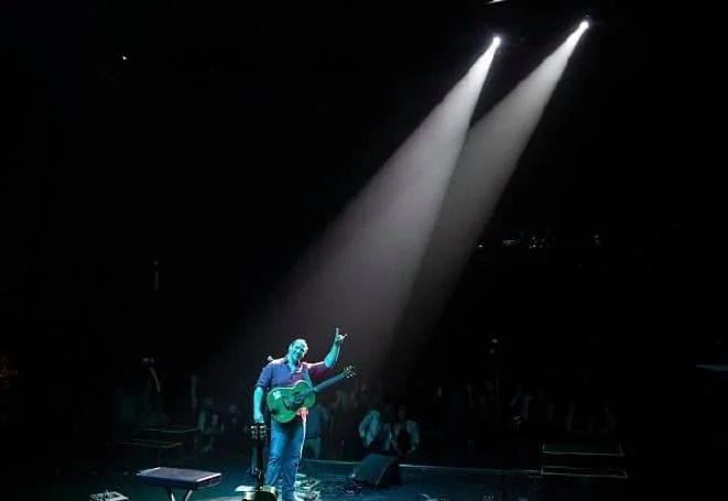 Shaun Hopper performing beneath the spotlights at Ruth Eckerd Hall