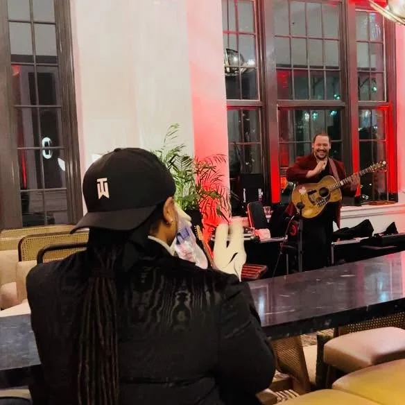Carter Beauford watching Shaun Hopper play guitar